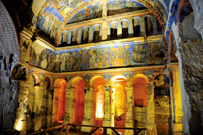 Vivid religious art line the walls of Tokali Cave in the Goreme Open-Air Museum