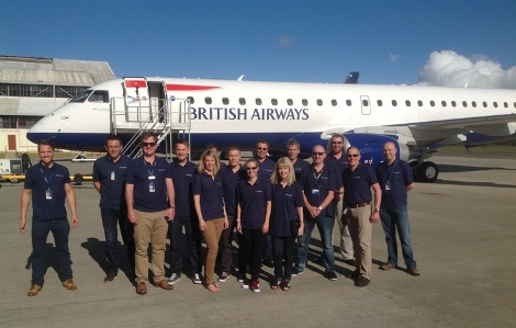 BA\\\\\\\\'s delivery team poses in front of one of two newly-delivered Embraer 190s at London City Airport