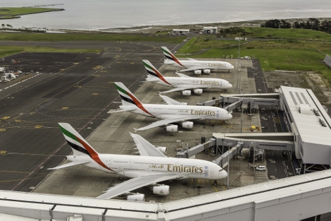 Four Emirates A380 aircraft lined up at Auckland Airport