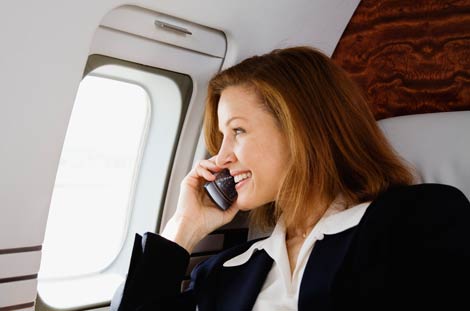 Woman on phone in plane