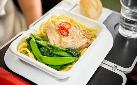Barramundi poached in a lightly spiced coconut sauce with noodles, sugar snaps, choy sum and chilli